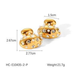 Detail view of gold-plated oval earrings with pearls and rhinestones showing size dimensions