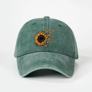 Vintage washed green baseball cap featuring printed sunflower and butterfly designs