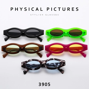 Collection of five narrow oval sunglasses in black, neon green, pink and amber colors