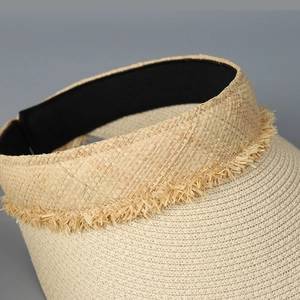 Chic beige open-top straw hat with lace fringe details and black inner lining band