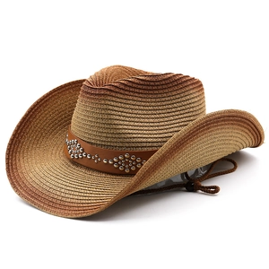 Detailed close-up of woven cowboy straw hat with studded leather band and chin cord