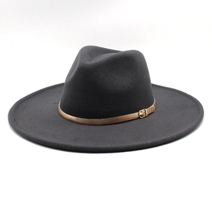 Detail of a black wide-brim wool fedora hat with a decorative gold metal buckle strap