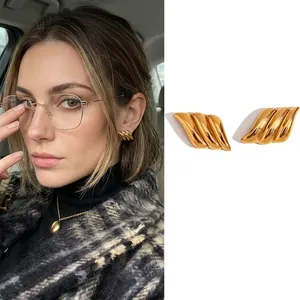 18K gold plated stainless steel wave wing earrings in a modern geometric stud design