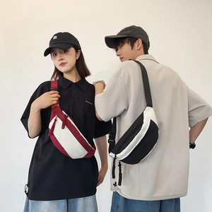 Waterproof unisex crossbody chest bag in black and burgundy dual-tone sporty design