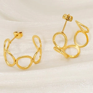 Double layer geometric hollow gold hoop earrings with textured finish in steel