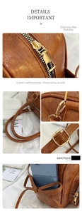 Close-up of brown leather bag with golden zipper, metal buckle and bow detail