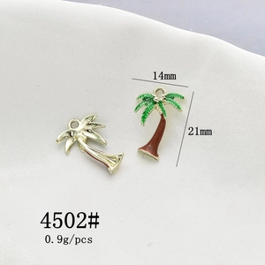 Detail of 21mm coconut tree enamel pendants with green lacquer for DIY jewelry making