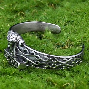 Detail of Viking Thor's Hammer engraving on vintage stainless steel open cuff bracelet