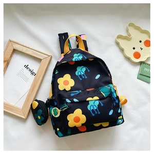 Detail of navy floral kids backpack with cute coin purse and colorful shoulder straps