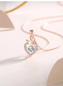 Detailed macro of S925 silver heart crown necklace with a floating center stone