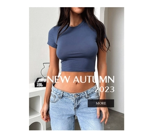 Close-up of slim fit navy blue short sleeve crop top with a modern round neckline
