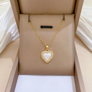 Titanium steel heart necklace and earrings set with shimmering shell and zircon pavé