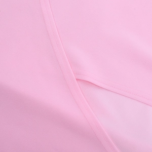 Close-up of pink fabric texture and fine stitching detail on elegant evening dress