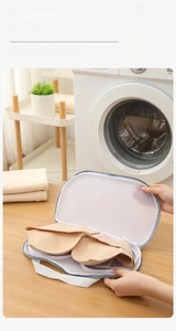 Detailed view of the wide-opening mesh laundry bag protecting a bra in the washing machine