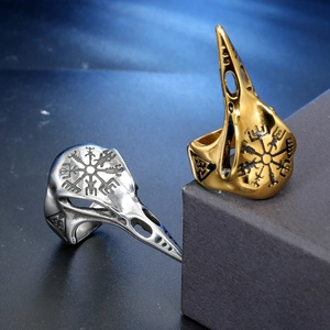 Detail of Viking bird skull rings in gold and silver finish with Vegvisir symbols