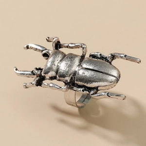 Macro detail of the retro silver beetle ring showing intricate texture and pincers