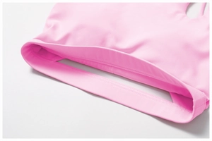 Detail of pink sports bra showing the wide elastic underband and flatlock seam stitching