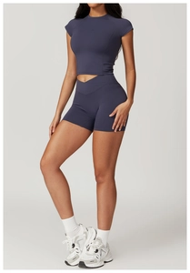 Side view of dark grey-blue yoga set with crop top and crossover high waist shorts