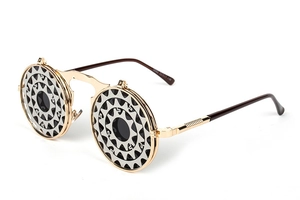 Detail of steampunk flip-up sunglasses with metal gear-shaped hollowed frame and round lens