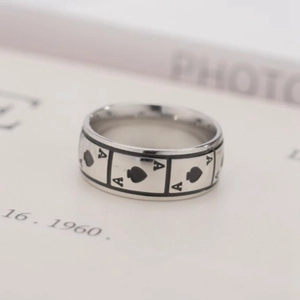 Detailed view of titanium steel ring featuring black Ace of Spades poker pattern