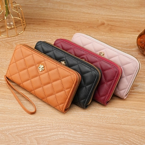 Elegant quilted leather wristlet wallet with gold camellia clasp in four stylish colors