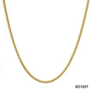 Close-up of a minimalist golden wheat chain necklace with polished metallic texture