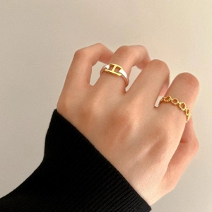 Minimalist 925 sterling silver twisted rings set with gold H-link and chain designs