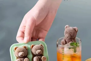 Detail showing silicone bear ice mold with realistic frozen texture and 3D bear shapes