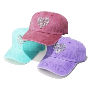 Three-pack washed cotton baseball caps for women with rhinestone heart design in pink blue purple