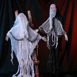 Detail of glowing skull ghosts in black and white with chains for Halloween decor
