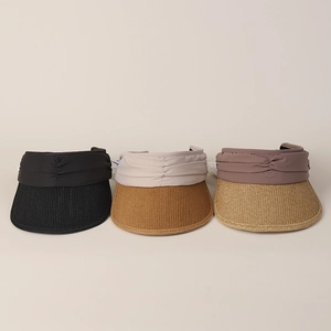Detailed view of women's sun visors with woven straw brims and pleated fabric in three colors
