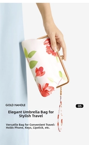 Floral print bag with gold handle for storing small items like phone and lipstick
