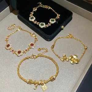 24K gold plated beaded flower bracelets with green and red emerald-tone gemstones
