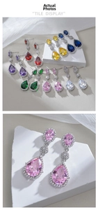 Detail of tear-drop crystal earrings in seven colors with polished zircon stones