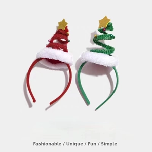 Detail of red and green glitter Christmas tree headbands with stars and plush trim