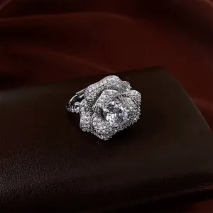 Exquisite French-style floral open ring with pavé zircons and oval center stone