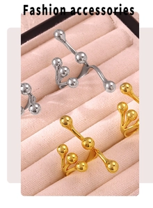 Fashionable branched open rings with metal spheres in gold and silver finish on velvet