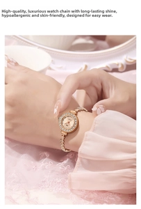 Close-up of elegant rose gold quartz watch with rhinestones on a female wrist