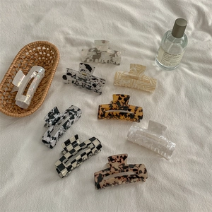 Elegant tortoiseshell and checkered acetate hair claw clips for thick hair styling