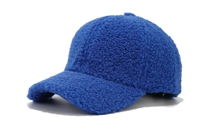 Detail of Klein blue lamb wool baseball cap showing plush texture and curved brim