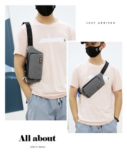 Detail of adjustable nylon strap and durable oxford fabric on grey crossbody bag