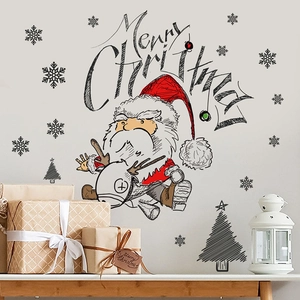 Detail of Christmas wall stickers featuring Santa on reindeer and snowflakes