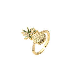 Detailed view of gold pineapple ring with green and white micro-set zircon stones