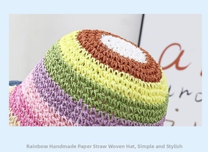 Close-up of handmade paper straw weave on rainbow bucket hat showing colorful textures