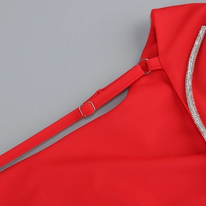 Detail of red elastic fabric with adjustable silver metal buckle and sparkling rhinestones