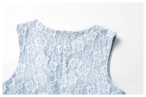 Detail of the invisible back zipper and floral lace texture on light blue dress