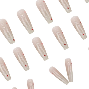 Pink gradient coffin press-on nails with red polka dots and shimmering glitter finish