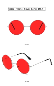 Detail view of round sunglasses featuring silver metal frames and vibrant red lenses