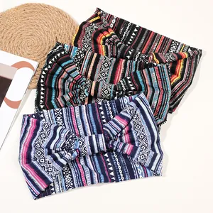 Three-pack of bohemian print wide headbands featuring cross-knot designs and geometric patterns