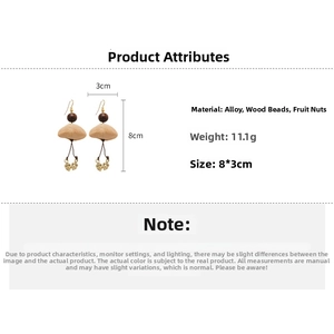 Detailed view of vintage wood bead and tiger eye earrings measuring 8x3cm with gold hooks